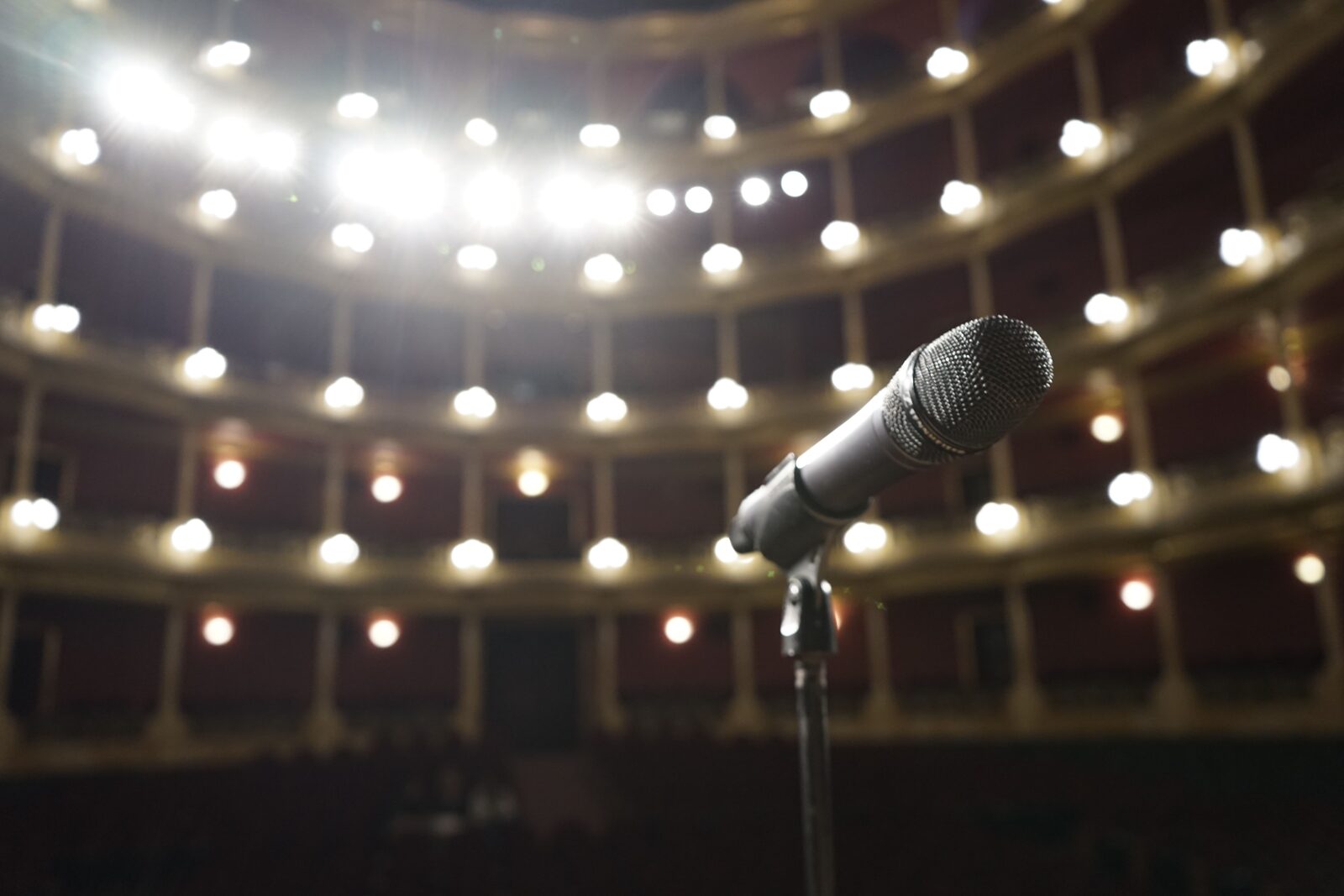 An empty theatre stage lit for a live event